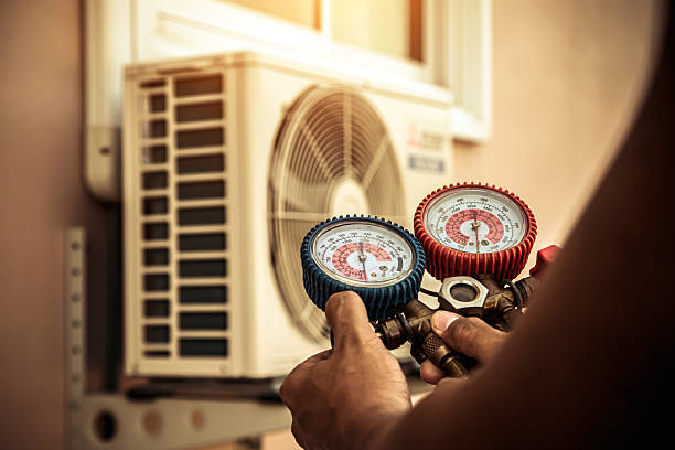 Professional Heat Pump Repair technician working in Dover, AR